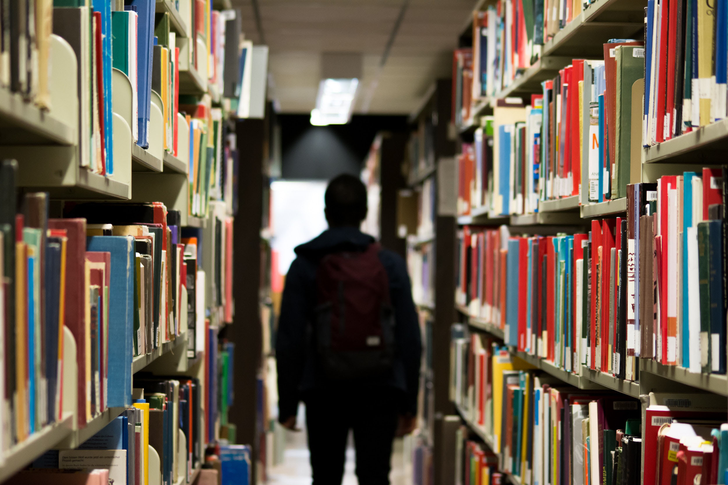 Student in the library going to second language class